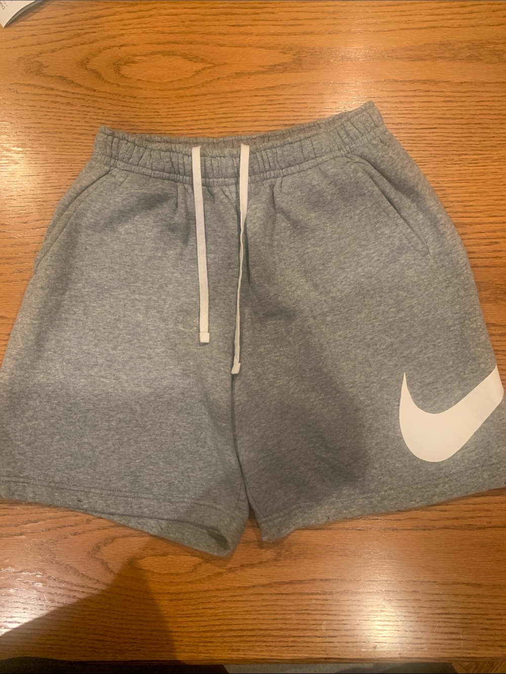Nike Gray Athletic Shorts with White Swoosh